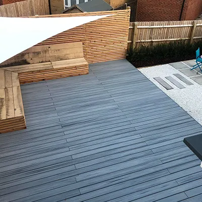 a patio with a table, chairs, and an umbrella